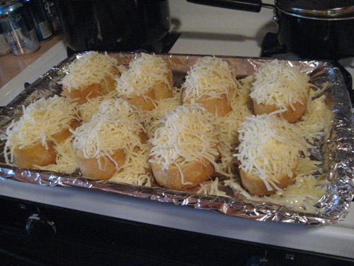 Lots of Cheese I tend to pour it over, and a lot gets lost to the tray. Thats ok. Just make sure the bread has lots of cheese on it.